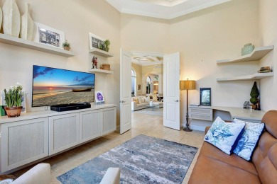 Nestled in the RARELY available Sand Cay community, this lovely on Ibis Golf and Country Club in Florida - for sale on GolfHomes.com, golf home, golf lot
