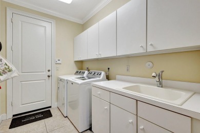 Nestled in the RARELY available Sand Cay community, this lovely on Ibis Golf and Country Club in Florida - for sale on GolfHomes.com, golf home, golf lot