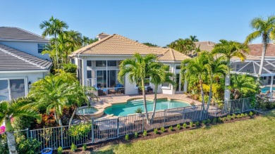 Nestled in the RARELY available Sand Cay community, this lovely on Ibis Golf and Country Club in Florida - for sale on GolfHomes.com, golf home, golf lot