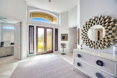 Sweeping water views will greet you when you walk into this on The Dunes Golf and Tennis Club in Florida - for sale on GolfHomes.com, golf home, golf lot