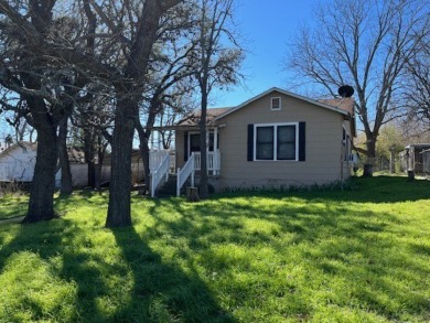 This charming two bedroom, one bath cottage is close to schools on Scott Schriener Municipal Golf Course in Texas - for sale on GolfHomes.com, golf home, golf lot