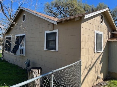 This charming two bedroom, one bath cottage is close to schools on Scott Schriener Municipal Golf Course in Texas - for sale on GolfHomes.com, golf home, golf lot