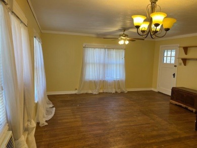 This charming two bedroom, one bath cottage is close to schools on Scott Schriener Municipal Golf Course in Texas - for sale on GolfHomes.com, golf home, golf lot