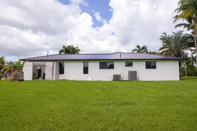 Welcome to this stunning 4-bedroom, 3-bathroom home at 17350 SW on Redland Golf and Country Club in Florida - for sale on GolfHomes.com, golf home, golf lot