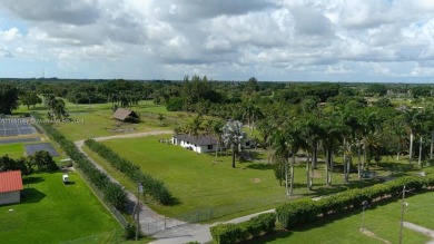 Welcome to this stunning 4-bedroom, 3-bathroom home at 17350 SW on Redland Golf and Country Club in Florida - for sale on GolfHomes.com, golf home, golf lot