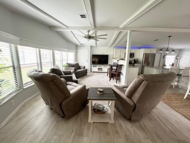 Such a pleasure to move into this updated DREAM HOME located on on Del Tura Golf and Country Club in Florida - for sale on GolfHomes.com, golf home, golf lot