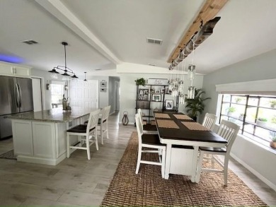 Such a pleasure to move into this updated DREAM HOME located on on Del Tura Golf and Country Club in Florida - for sale on GolfHomes.com, golf home, golf lot