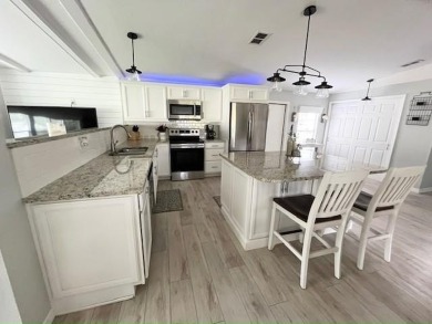 Such a pleasure to move into this updated DREAM HOME located on on Del Tura Golf and Country Club in Florida - for sale on GolfHomes.com, golf home, golf lot