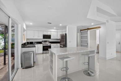 Modernly updated, move-in ready 2BR/2.5BA single-story corner on Broken Sound Golf and Club  in Florida - for sale on GolfHomes.com, golf home, golf lot