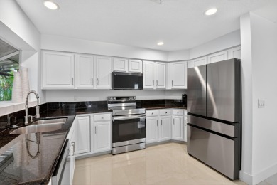 Modernly updated, move-in ready 2BR/2.5BA single-story corner on Broken Sound Golf and Club  in Florida - for sale on GolfHomes.com, golf home, golf lot