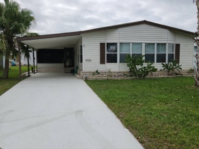 Your Dream Florida Getaway: 2 Bedroom, 2 Bath Manufactured Home on Spanish Lakes Fairways in Florida - for sale on GolfHomes.com, golf home, golf lot