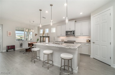 This Delray model from the Traditional Series features a tile on Herons Glen Golf and Country Club in Florida - for sale on GolfHomes.com, golf home, golf lot
