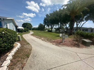 BEAUTIFUL 3 BEDROOM HOME ON GOLF COURSE WITH A GARAGE - REDUCED on Four Lakes Golf Club in Florida - for sale on GolfHomes.com, golf home, golf lot