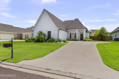 Do not miss this Beautiful white brick home with wonderful on Lake Caroline Golf Club in Mississippi - for sale on GolfHomes.com, golf home, golf lot