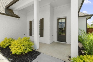 Do not miss this Beautiful white brick home with wonderful on Lake Caroline Golf Club in Mississippi - for sale on GolfHomes.com, golf home, golf lot