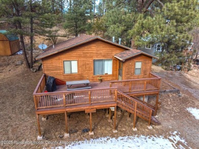 Located in the heart of Ruidoso, this 2-bedroom, 2-bath cabin is on Cree Meadows Country Club in New Mexico - for sale on GolfHomes.com, golf home, golf lot