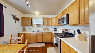 Located in the heart of Ruidoso, this 2-bedroom, 2-bath cabin is on Cree Meadows Country Club in New Mexico - for sale on GolfHomes.com, golf home, golf lot