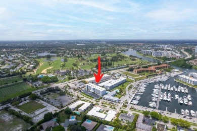 Experience the best of coastal living at 155 Yacht Club Drive on North Palm Beach Country Club in Florida - for sale on GolfHomes.com, golf home, golf lot
