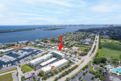 Experience the best of coastal living at 155 Yacht Club Drive on North Palm Beach Country Club in Florida - for sale on GolfHomes.com, golf home, golf lot