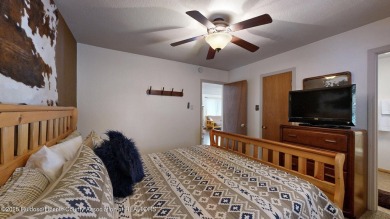 Located in the heart of Ruidoso, this 2-bedroom, 2-bath cabin is on Cree Meadows Country Club in New Mexico - for sale on GolfHomes.com, golf home, golf lot