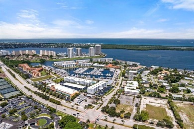 Experience the best of coastal living at 155 Yacht Club Drive on North Palm Beach Country Club in Florida - for sale on GolfHomes.com, golf home, golf lot
