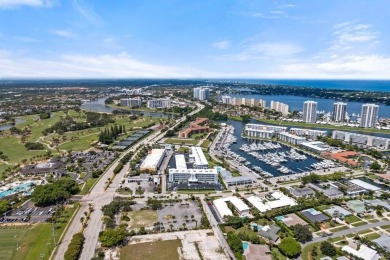 Experience the best of coastal living at 155 Yacht Club Drive on North Palm Beach Country Club in Florida - for sale on GolfHomes.com, golf home, golf lot