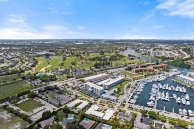 Experience the best of coastal living at 155 Yacht Club Drive on North Palm Beach Country Club in Florida - for sale on GolfHomes.com, golf home, golf lot