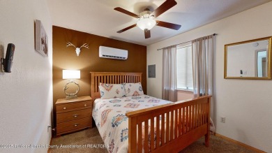 Located in the heart of Ruidoso, this 2-bedroom, 2-bath cabin is on Cree Meadows Country Club in New Mexico - for sale on GolfHomes.com, golf home, golf lot