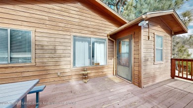 Located in the heart of Ruidoso, this 2-bedroom, 2-bath cabin is on Cree Meadows Country Club in New Mexico - for sale on GolfHomes.com, golf home, golf lot