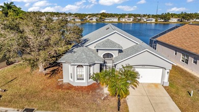 Experience the Florida lifestyle at its finest in this on Kings Gate Golf Club in Florida - for sale on GolfHomes.com, golf home, golf lot