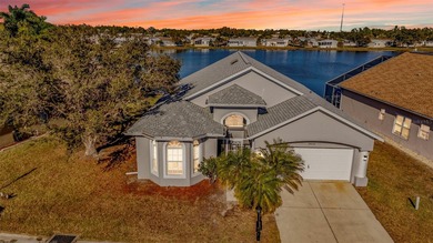 Experience the Florida lifestyle at its finest in this on Kings Gate Golf Club in Florida - for sale on GolfHomes.com, golf home, golf lot