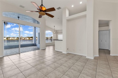 Experience the Florida lifestyle at its finest in this on Kings Gate Golf Club in Florida - for sale on GolfHomes.com, golf home, golf lot