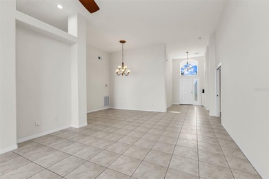 Experience the Florida lifestyle at its finest in this on Kings Gate Golf Club in Florida - for sale on GolfHomes.com, golf home, golf lot