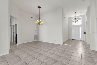 Experience the Florida lifestyle at its finest in this on Kings Gate Golf Club in Florida - for sale on GolfHomes.com, golf home, golf lot