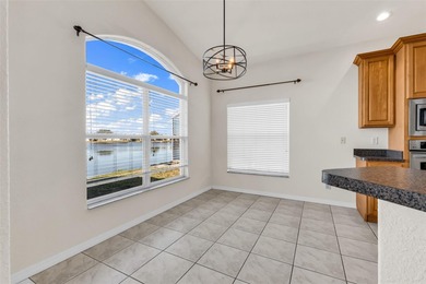 Experience the Florida lifestyle at its finest in this on Kings Gate Golf Club in Florida - for sale on GolfHomes.com, golf home, golf lot