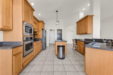 Experience the Florida lifestyle at its finest in this on Kings Gate Golf Club in Florida - for sale on GolfHomes.com, golf home, golf lot