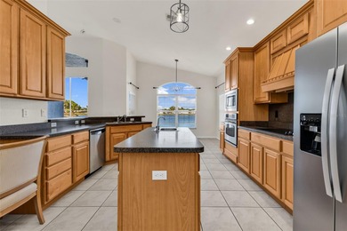 Experience the Florida lifestyle at its finest in this on Kings Gate Golf Club in Florida - for sale on GolfHomes.com, golf home, golf lot