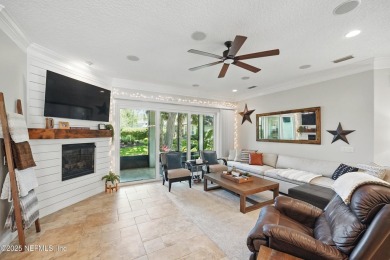 Nestled beneath a canopy of mature oak trees in the gated on Queens Harbour Yacht and Country Club in Florida - for sale on GolfHomes.com, golf home, golf lot
