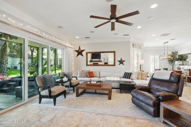 Nestled beneath a canopy of mature oak trees in the gated on Queens Harbour Yacht and Country Club in Florida - for sale on GolfHomes.com, golf home, golf lot