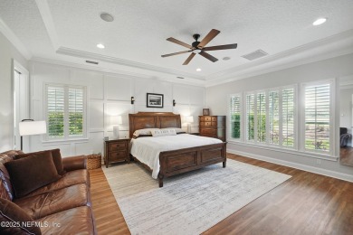 Nestled beneath a canopy of mature oak trees in the gated on Queens Harbour Yacht and Country Club in Florida - for sale on GolfHomes.com, golf home, golf lot