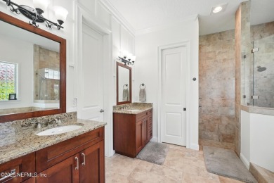Nestled beneath a canopy of mature oak trees in the gated on Queens Harbour Yacht and Country Club in Florida - for sale on GolfHomes.com, golf home, golf lot
