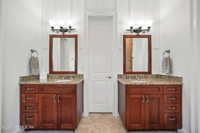 Nestled beneath a canopy of mature oak trees in the gated on Queens Harbour Yacht and Country Club in Florida - for sale on GolfHomes.com, golf home, golf lot
