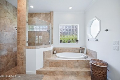 Nestled beneath a canopy of mature oak trees in the gated on Queens Harbour Yacht and Country Club in Florida - for sale on GolfHomes.com, golf home, golf lot