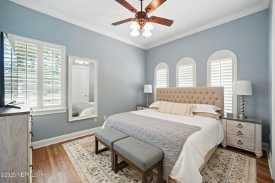 Nestled beneath a canopy of mature oak trees in the gated on Queens Harbour Yacht and Country Club in Florida - for sale on GolfHomes.com, golf home, golf lot