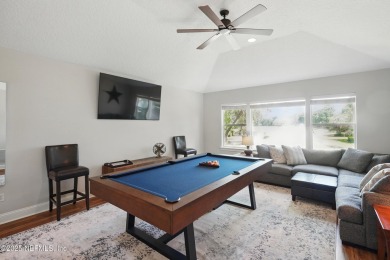 Nestled beneath a canopy of mature oak trees in the gated on Queens Harbour Yacht and Country Club in Florida - for sale on GolfHomes.com, golf home, golf lot