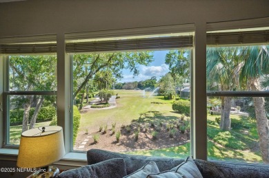 Nestled beneath a canopy of mature oak trees in the gated on Queens Harbour Yacht and Country Club in Florida - for sale on GolfHomes.com, golf home, golf lot