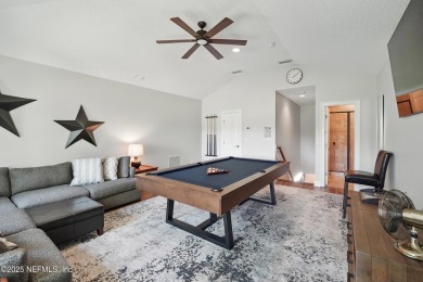 Nestled beneath a canopy of mature oak trees in the gated on Queens Harbour Yacht and Country Club in Florida - for sale on GolfHomes.com, golf home, golf lot