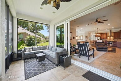 Nestled beneath a canopy of mature oak trees in the gated on Queens Harbour Yacht and Country Club in Florida - for sale on GolfHomes.com, golf home, golf lot