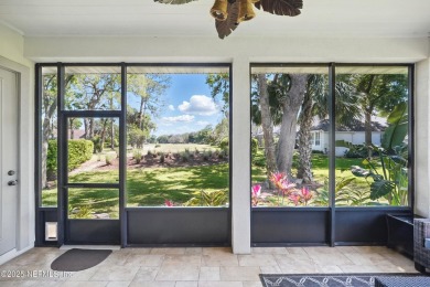 Nestled beneath a canopy of mature oak trees in the gated on Queens Harbour Yacht and Country Club in Florida - for sale on GolfHomes.com, golf home, golf lot