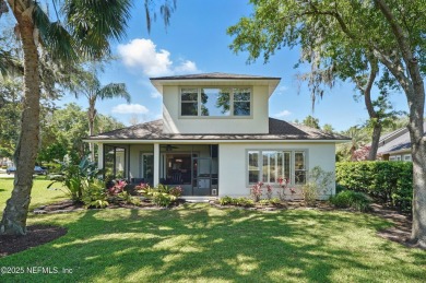 Nestled beneath a canopy of mature oak trees in the gated on Queens Harbour Yacht and Country Club in Florida - for sale on GolfHomes.com, golf home, golf lot